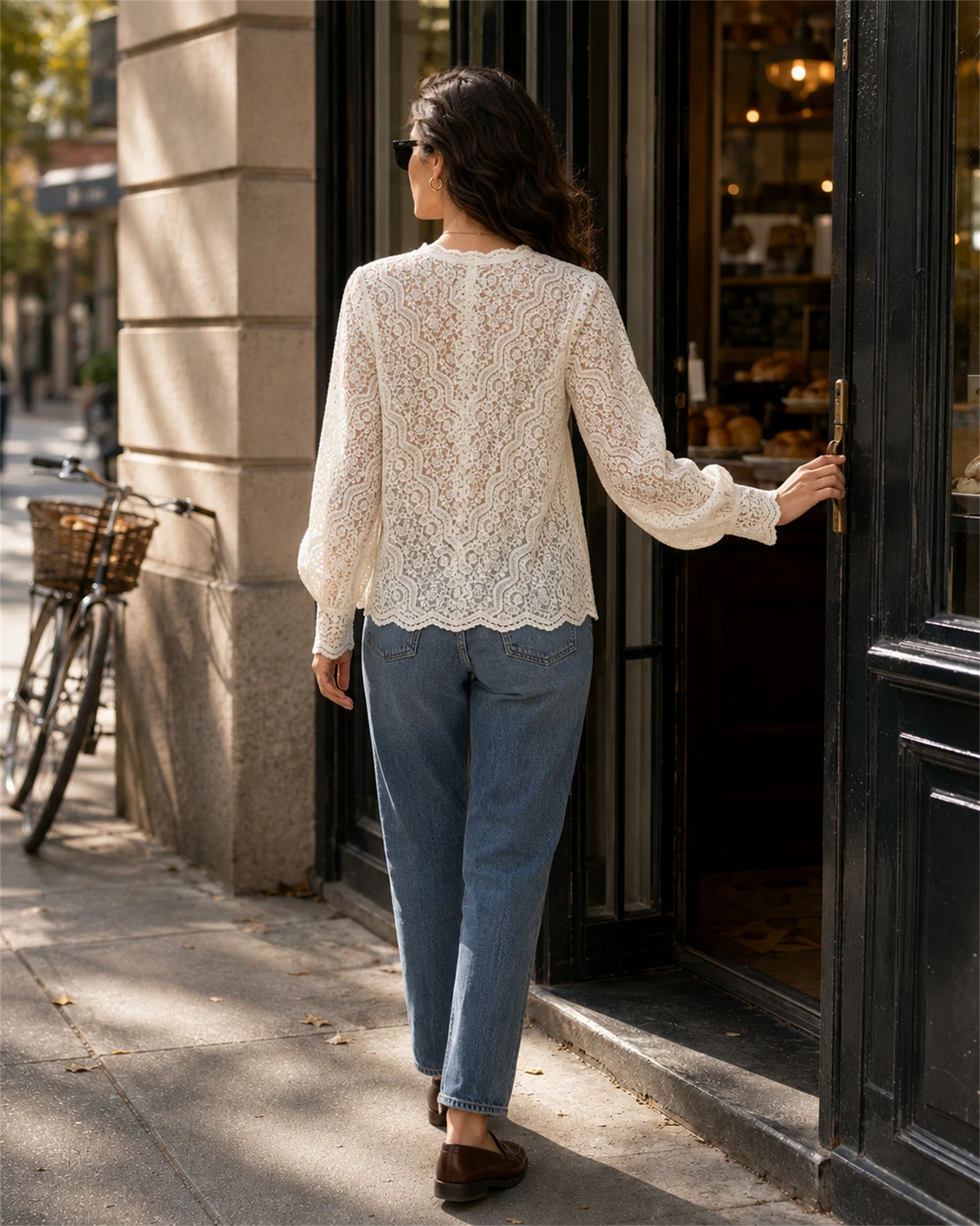 Back view of the relaxed floral lace long-sleeve blouse