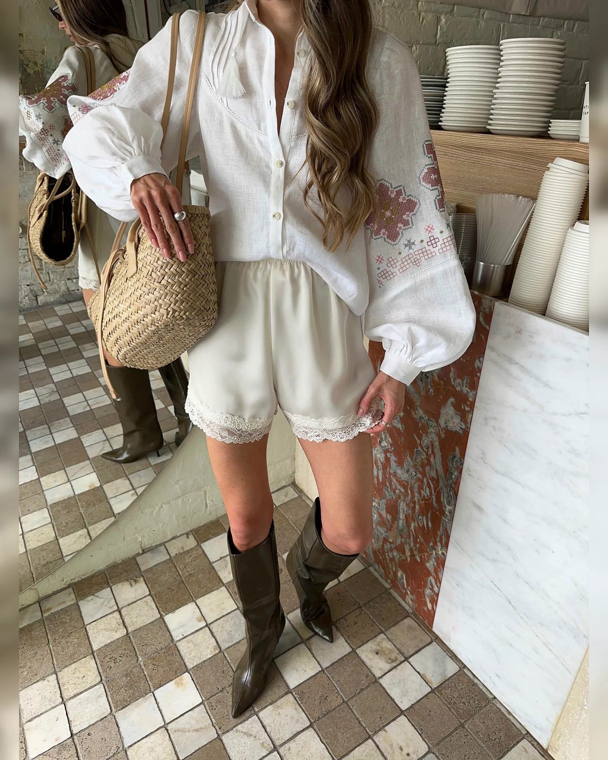 Front view of the Sunlit Folk white balloon-sleeve blouse