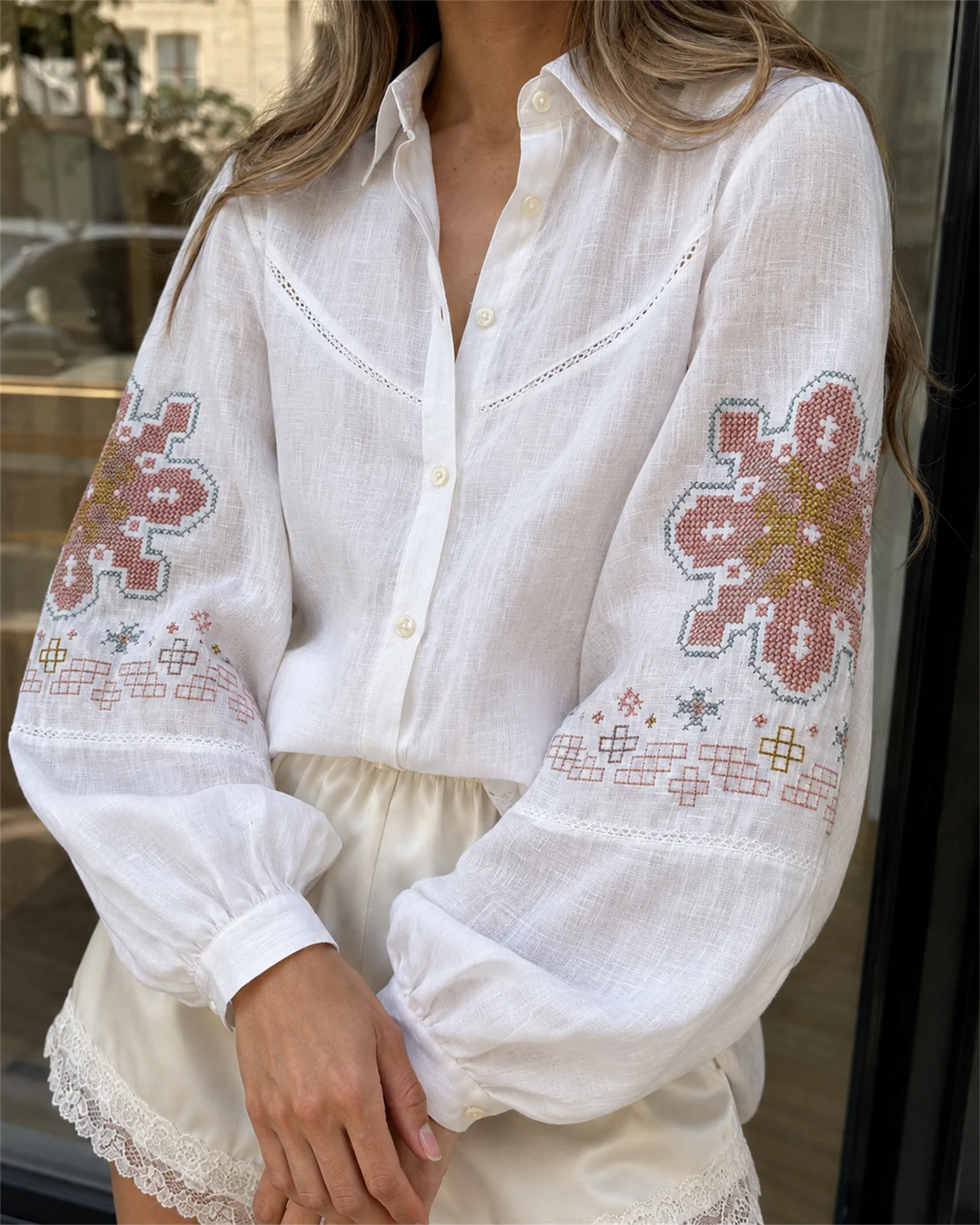 Close-up of the sleeve embroidery textured fabric and tonal buttons