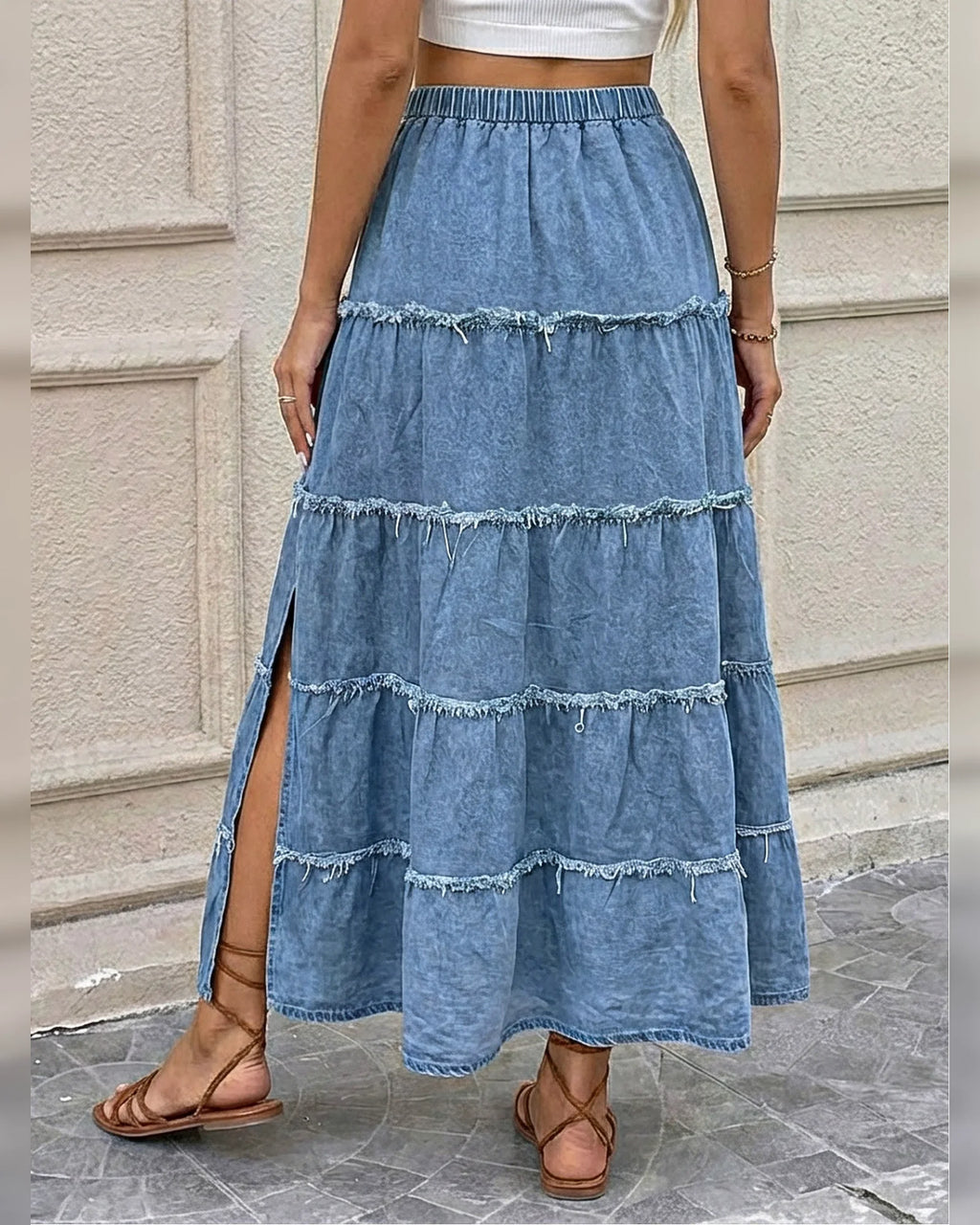Back detail of the elastic waist and raw-edge denim tiers